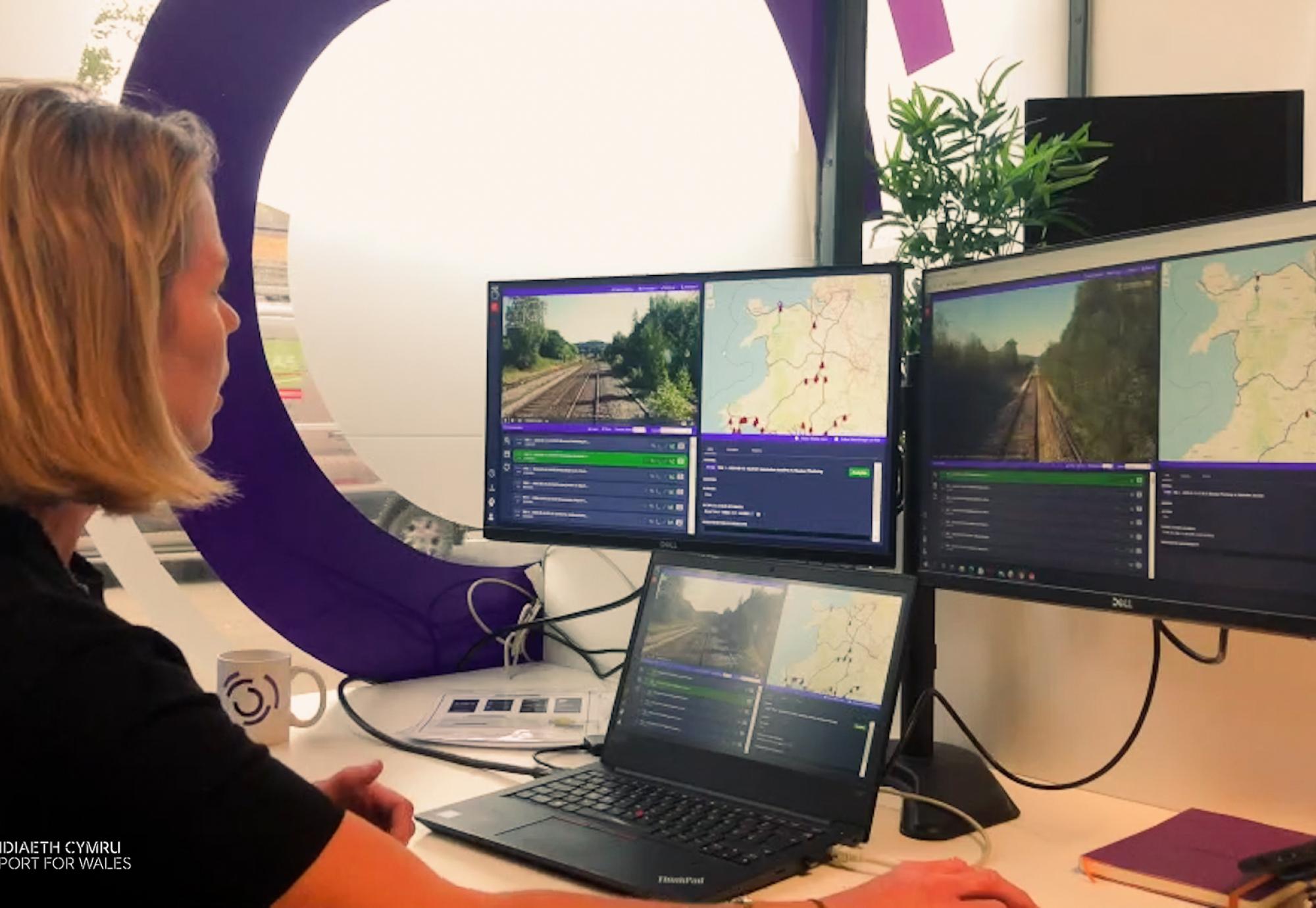 Woman looking at computer screens