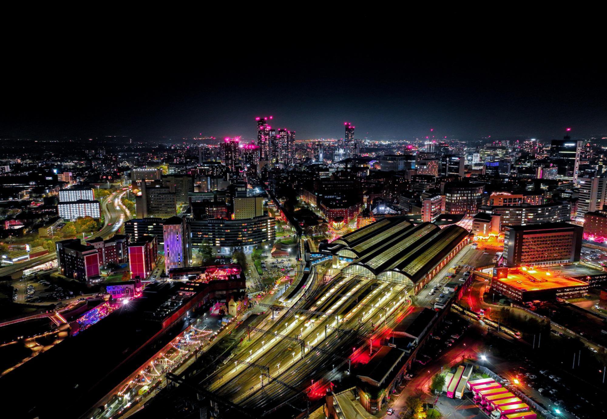 Aerial photograph of Piccadilly Railway Station in Manchester City Centre at Night