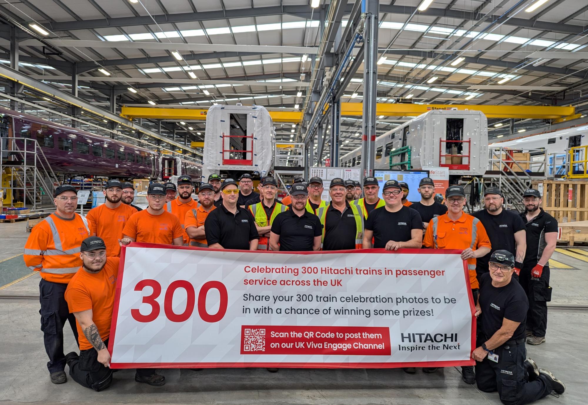 Staff celebrating 300th Hitachi Train