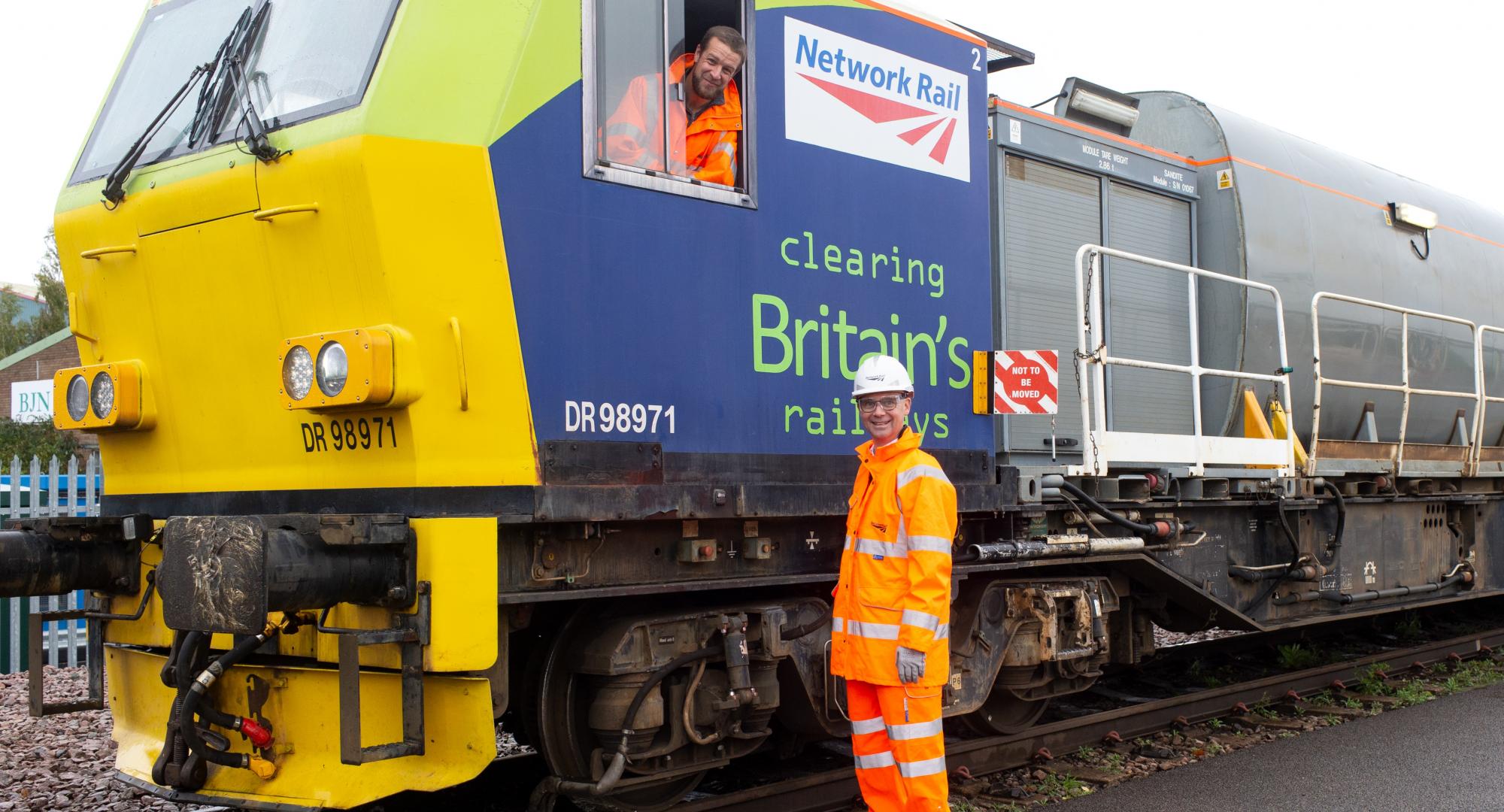 Paul Plawecki of Balfour Beatty and Rob Davis of Network Rail with a leaf-busting train