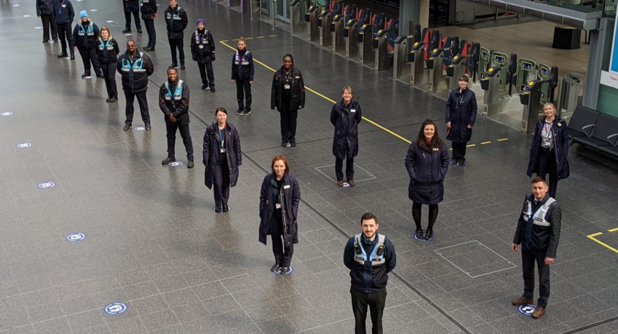 Train crew and station staff on the social distancing guides at Manchester Piccadilly