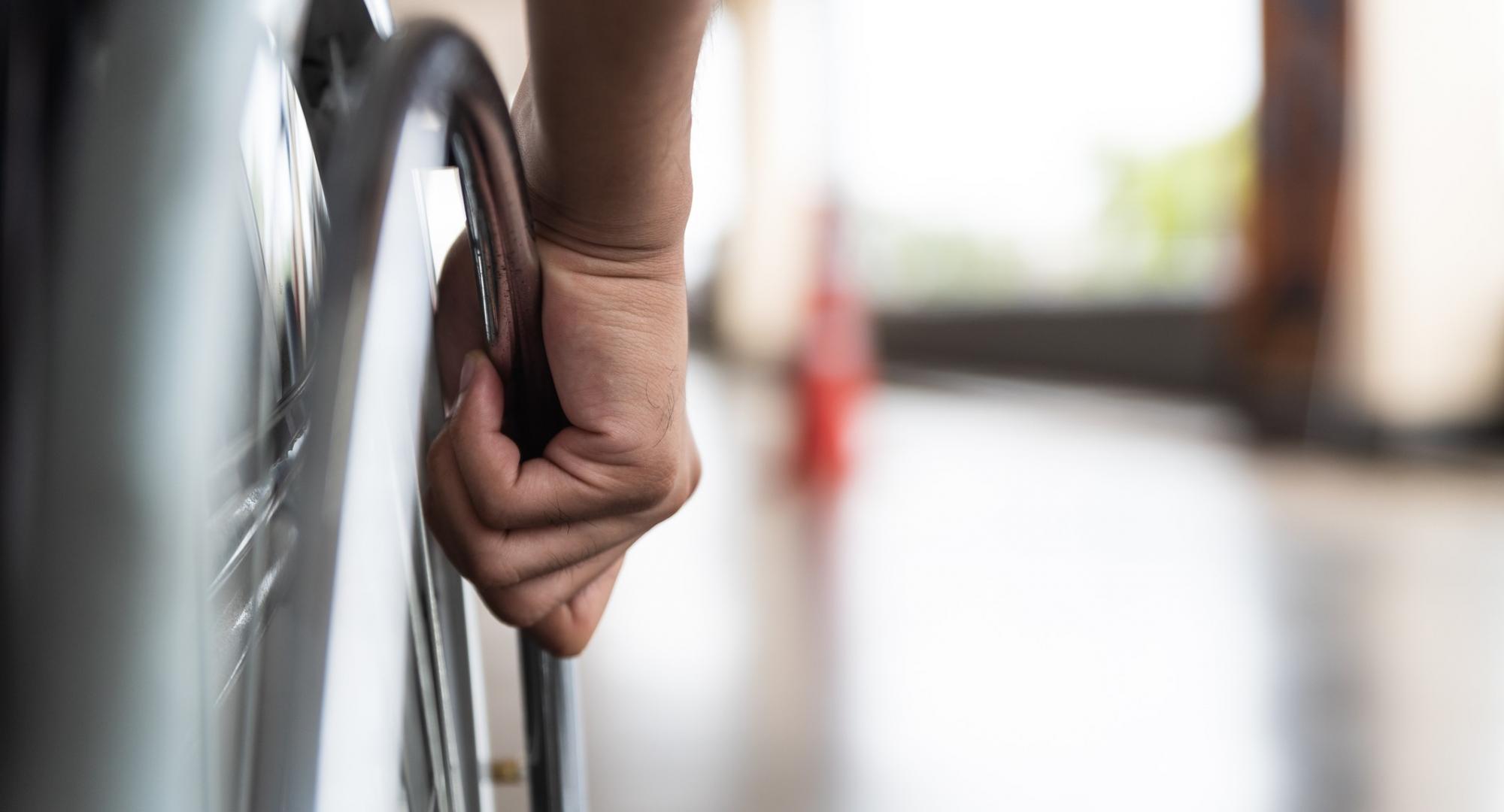 Wheelchair user on an out-of-focus platform