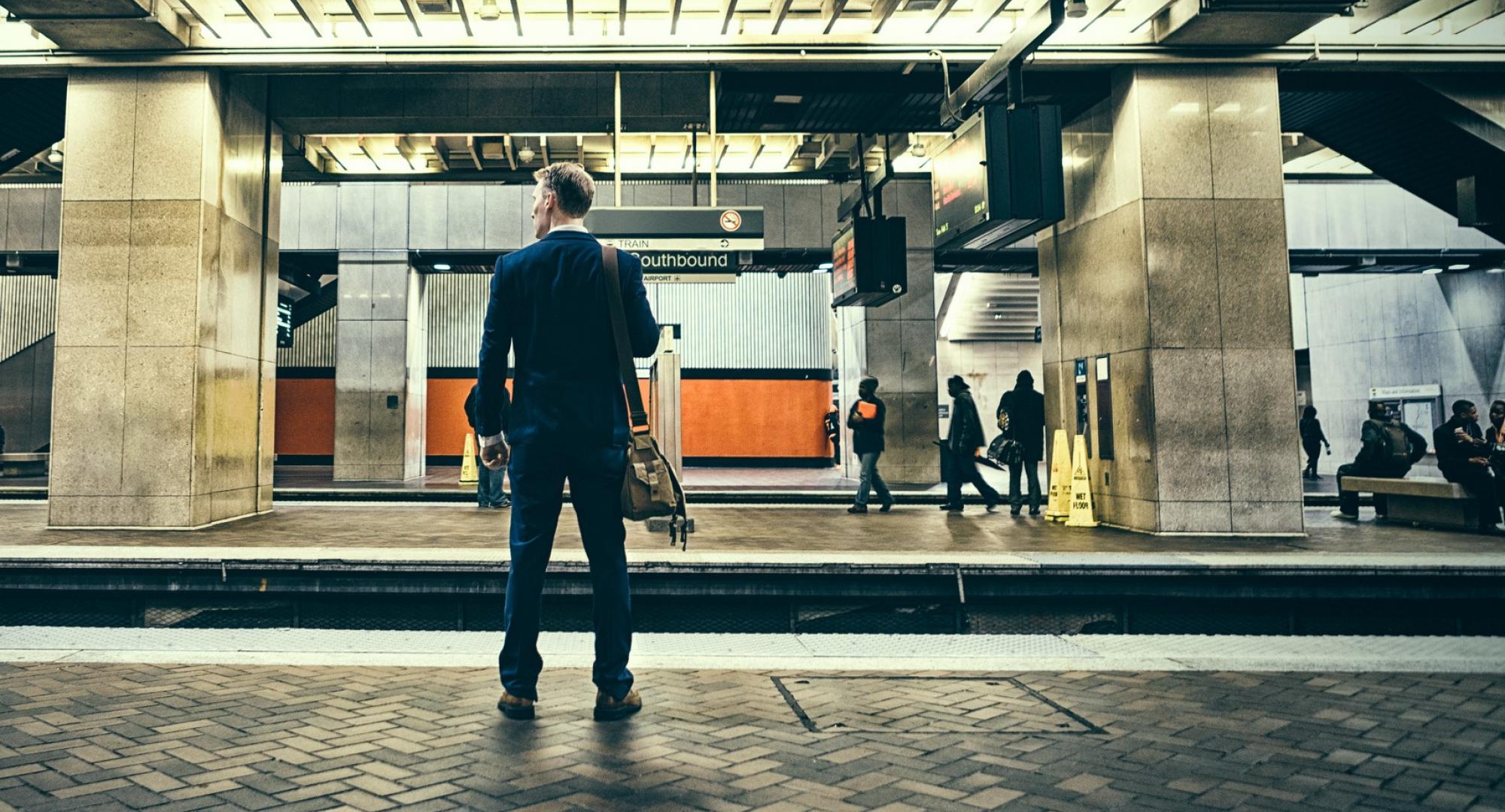 Businessman waiting at a train platform