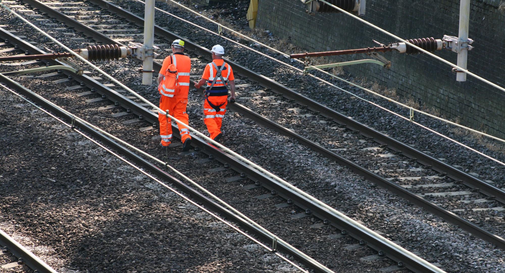 Rail workers on the train line