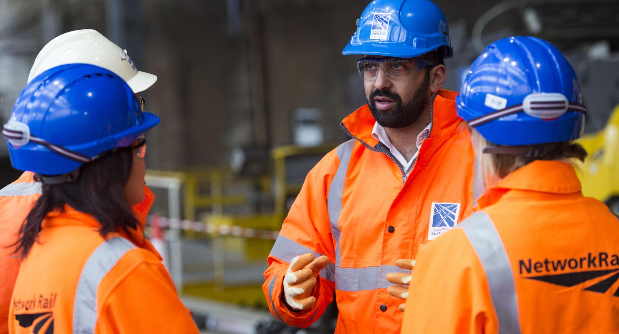 Humza Yousaf talking with Network Rail staff