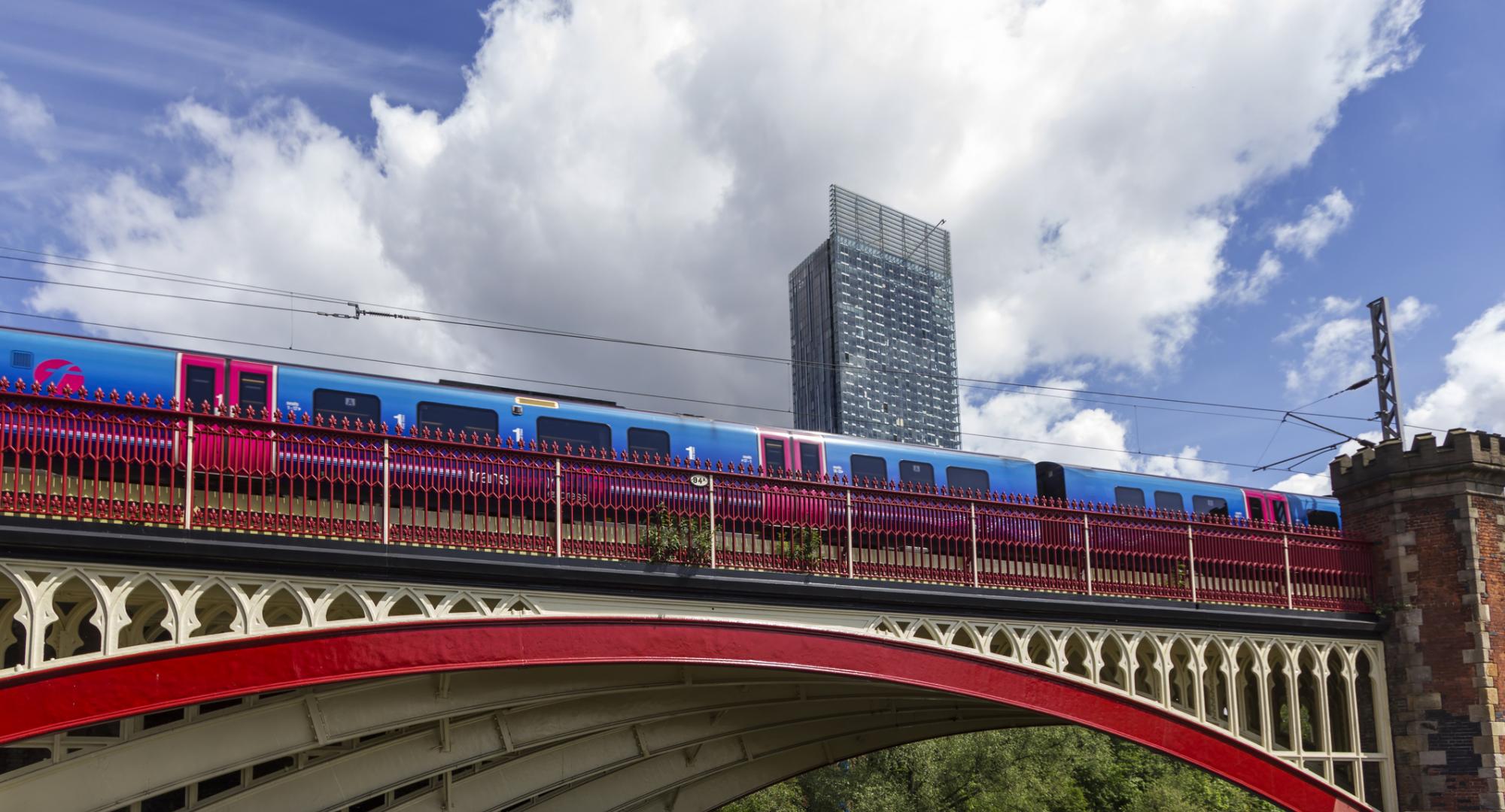 Train passing over a bridge in Manchester