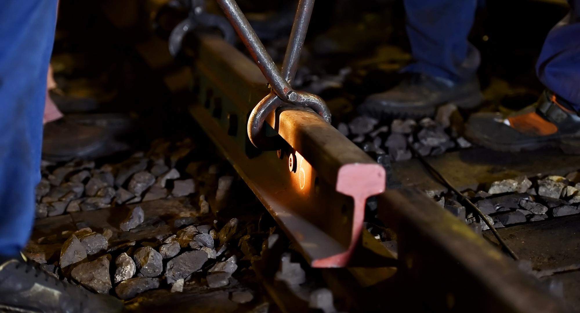 Rail workers laying a section of track