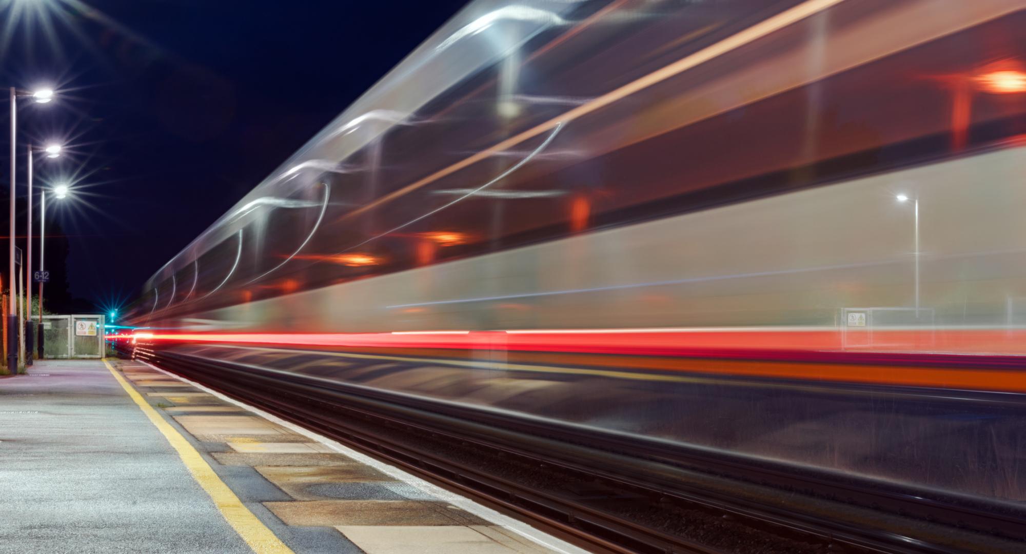 Train in motion at a platform