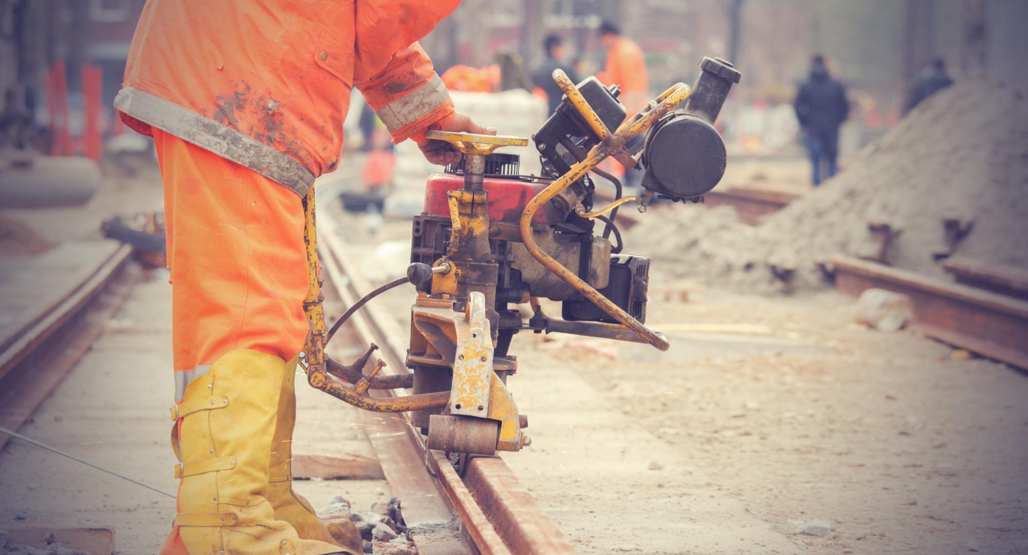 Welder performing work on a section of track