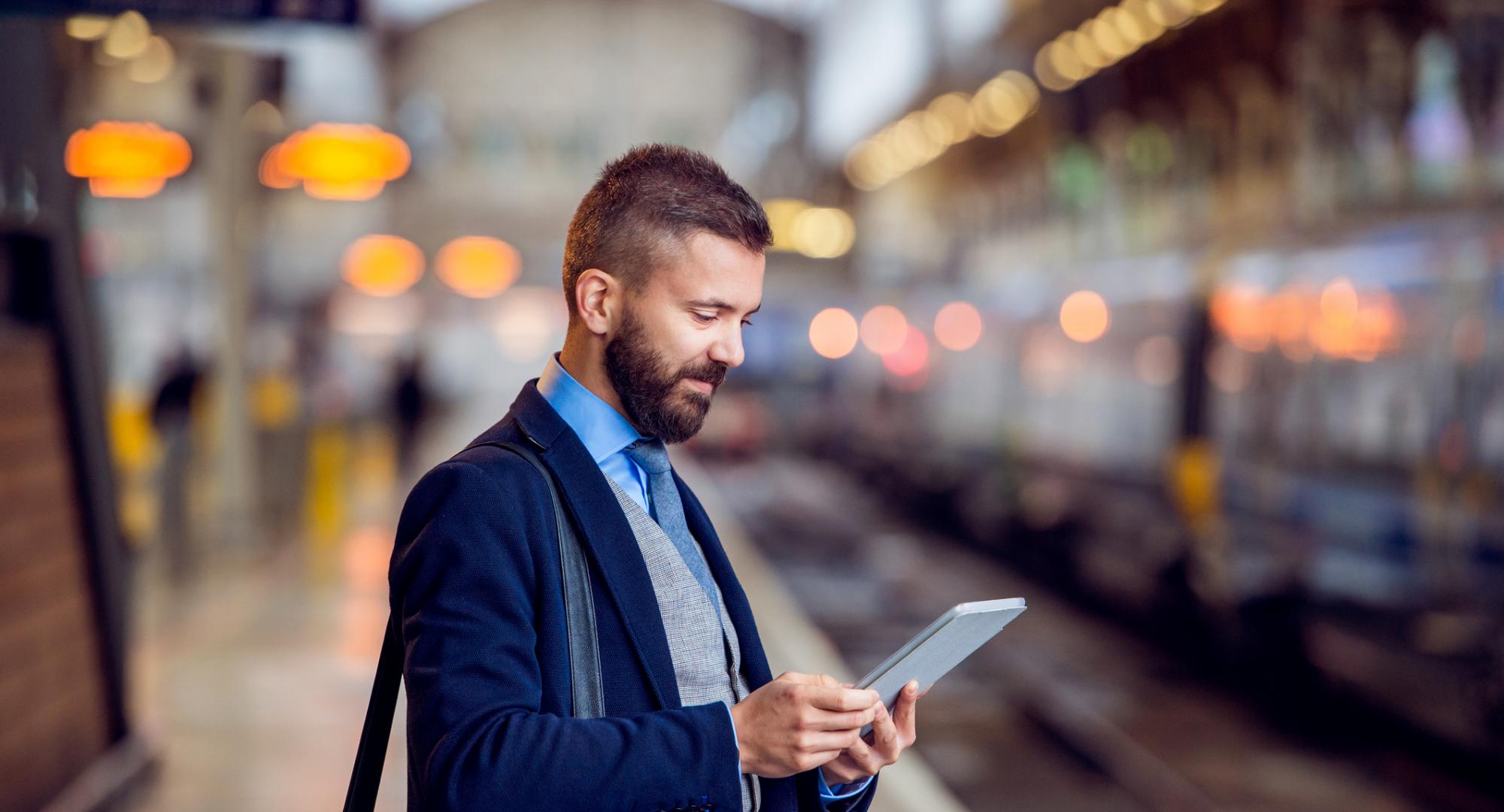 Businessman waiting for a train in London