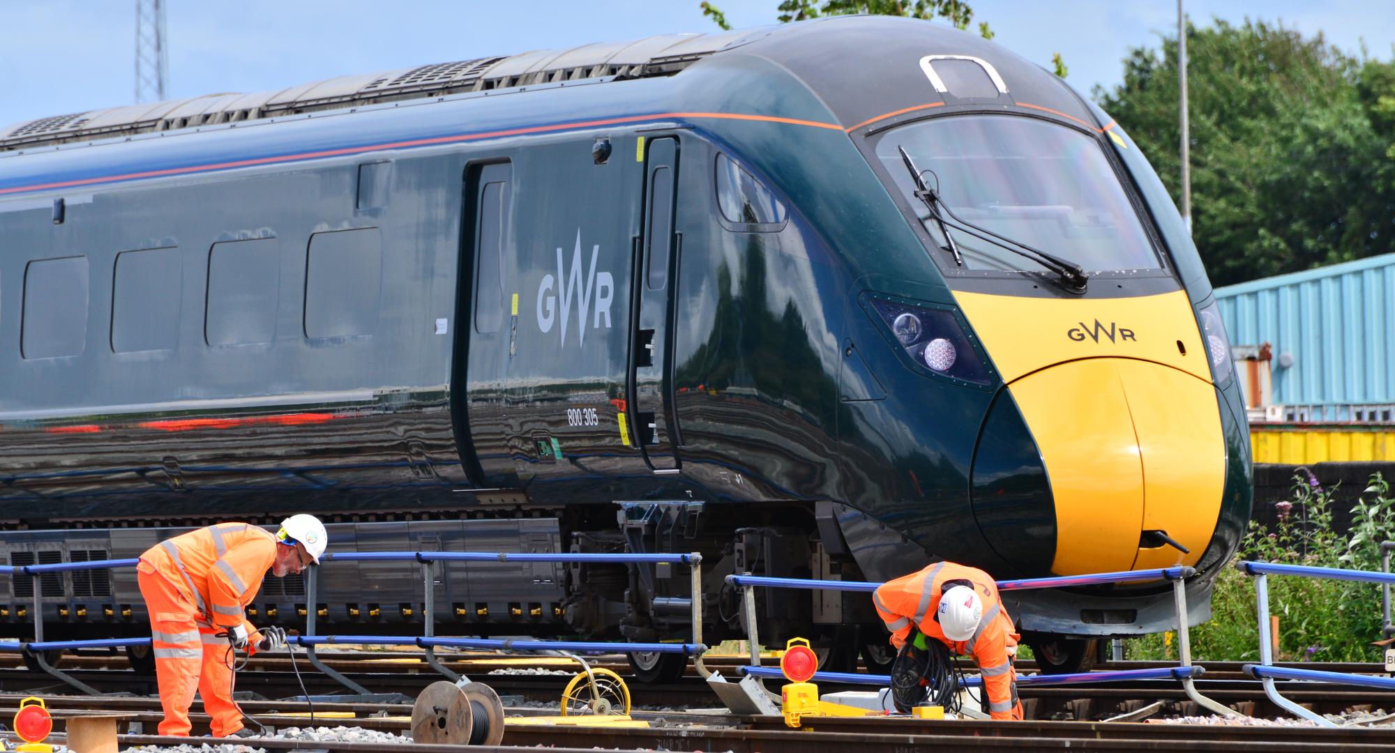 Engineers working in front of the train