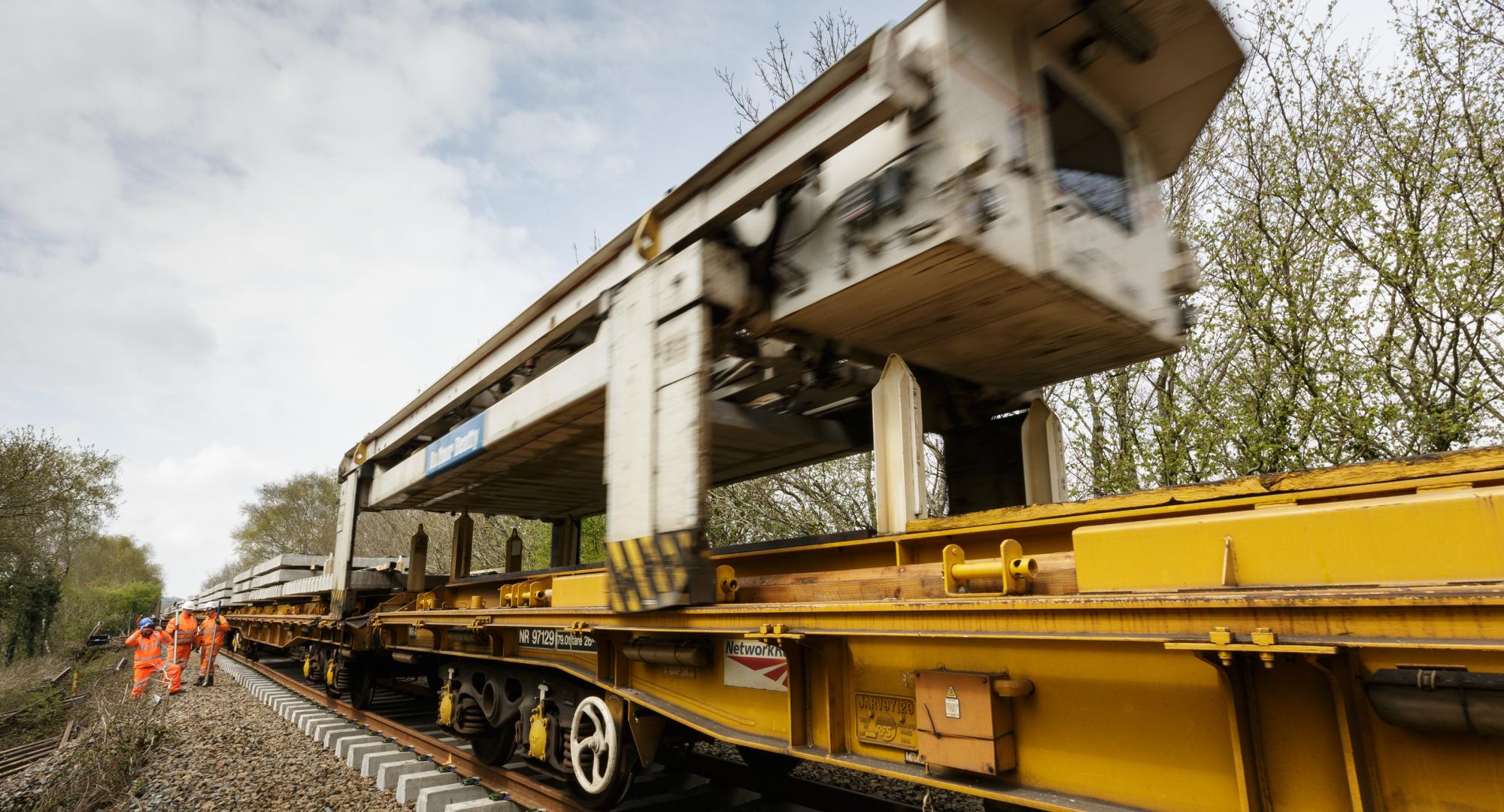 The NTC (new track construction) machine in action on the Dartmoor Line, via Network Rail 