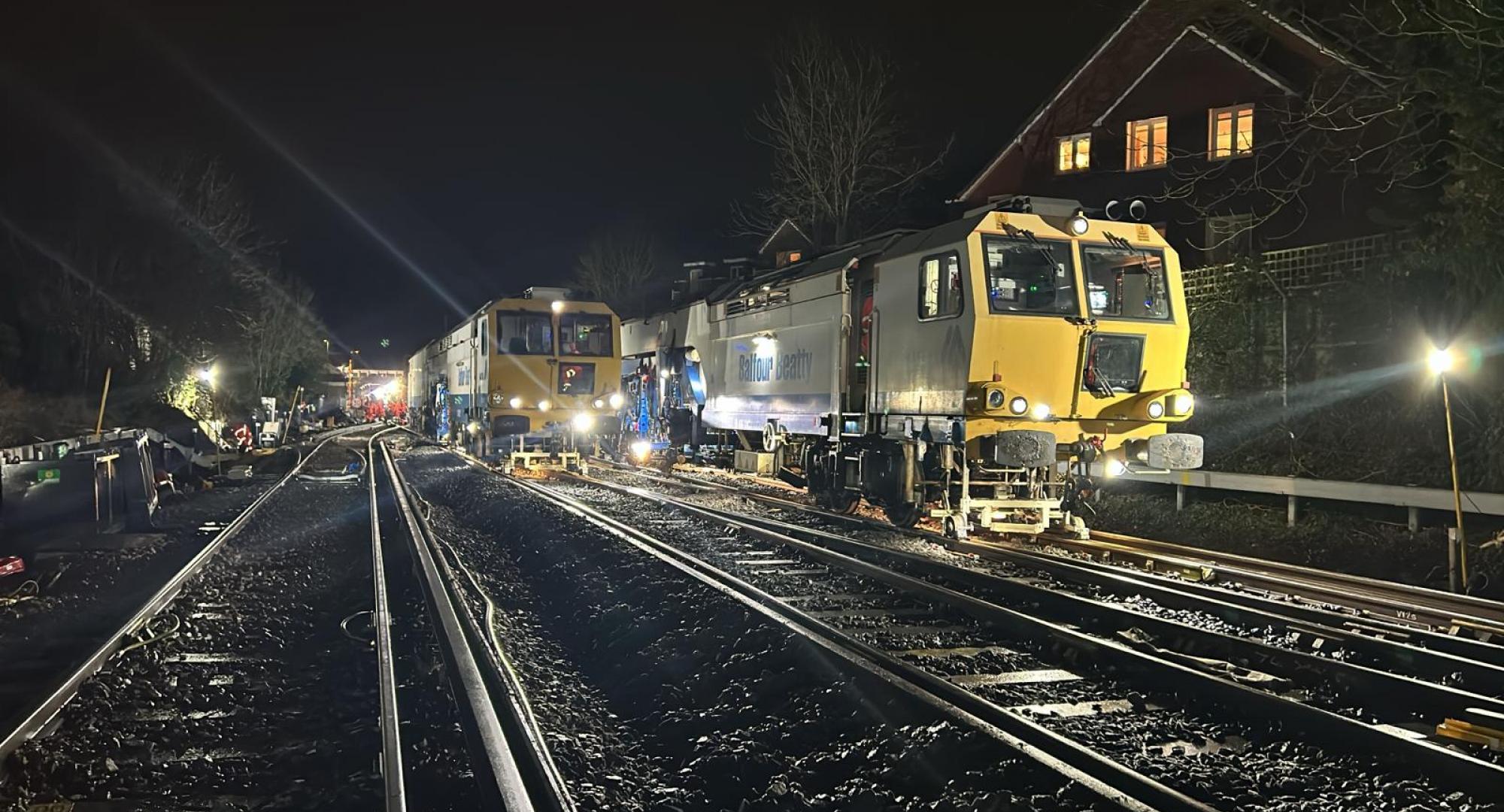 A tamping machine working at night in Wokingham