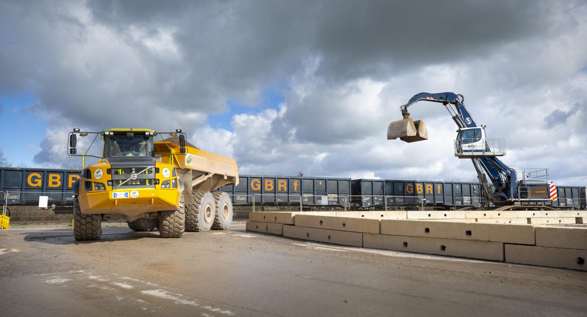 Material delivered by rail to Quainton railhead is taken away on an articulated dumper truck Feb 2024