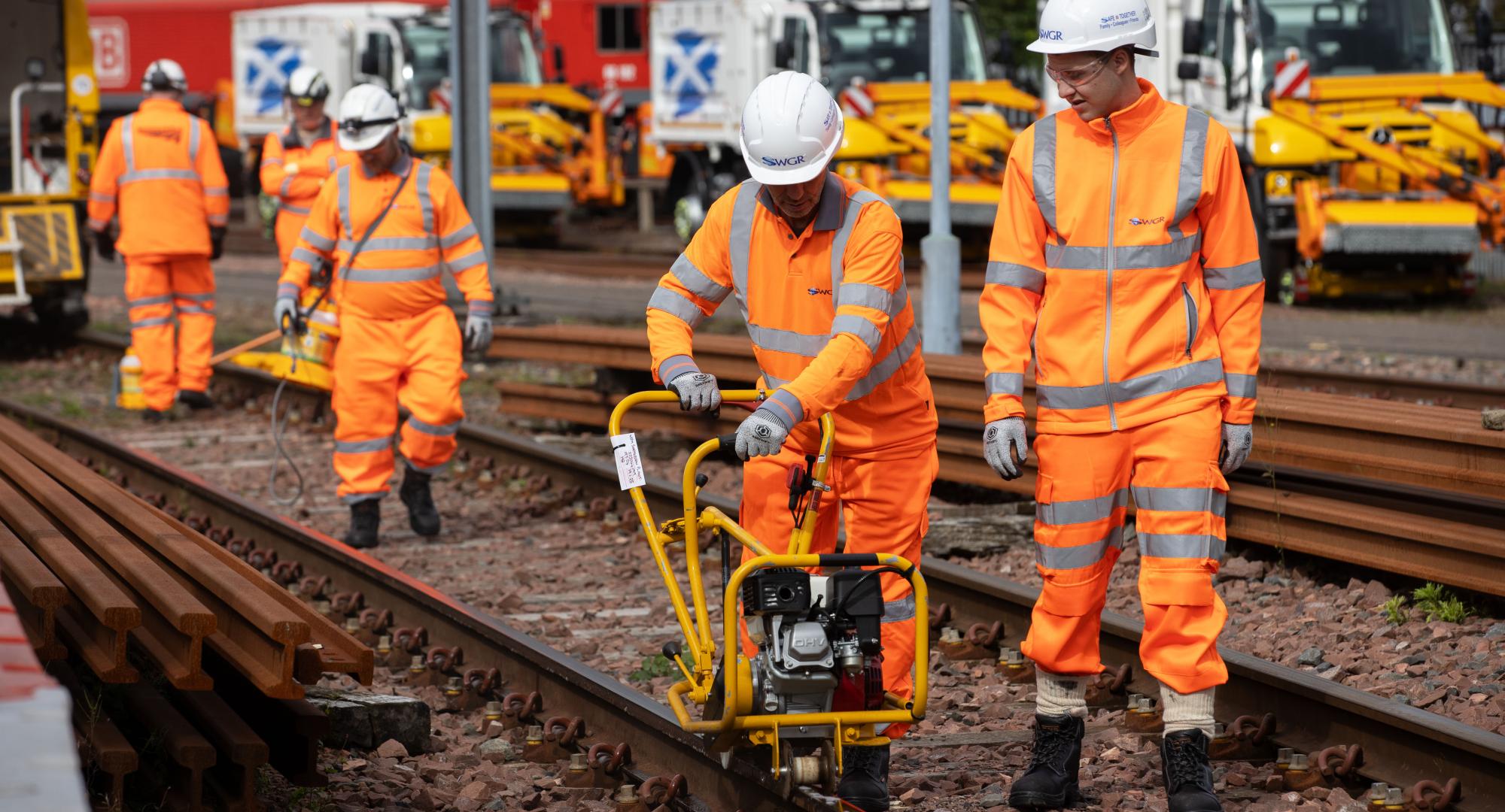 Leaf busting team cleaning the rails