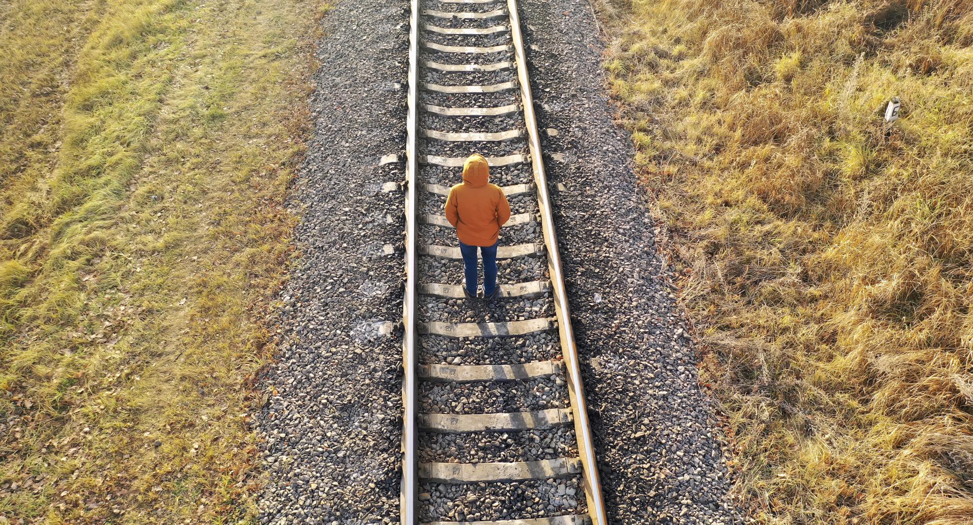 Man stood on train tracks