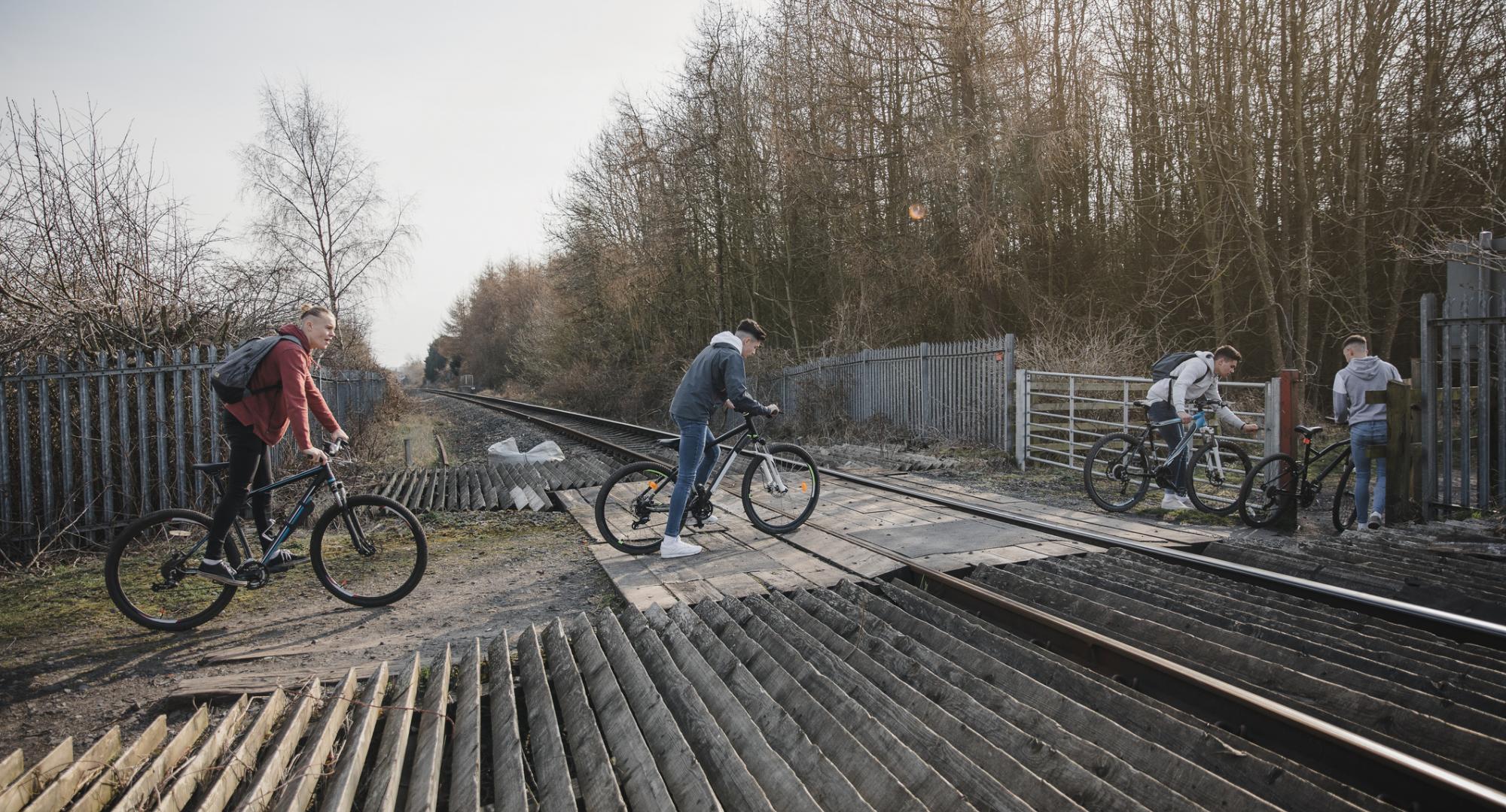 Teenagers on a level crossing