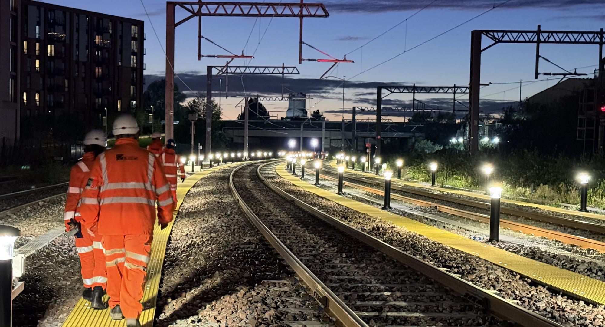 Workers inspecting new Oldfield Road turnback siding