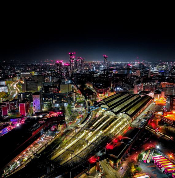 Aerial photograph of Piccadilly Railway Station in Manchester City Centre at Night