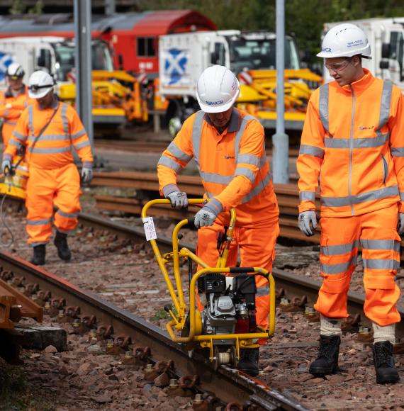 Leaf busting team cleaning the rails