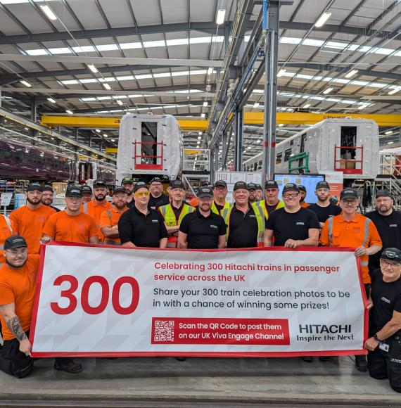 Staff celebrating 300th Hitachi Train