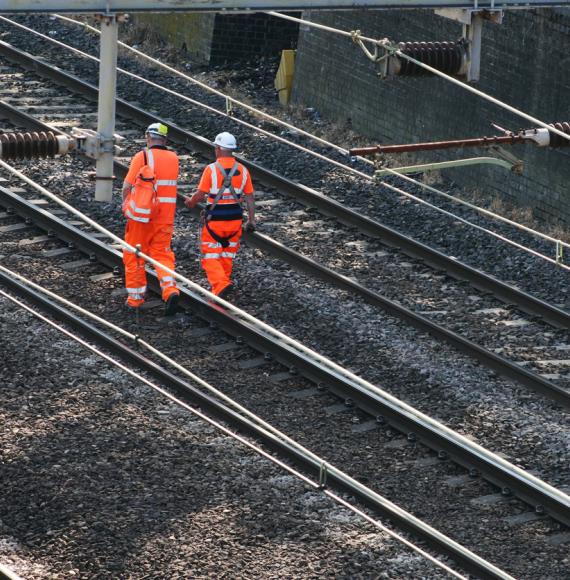 Men walking on a track